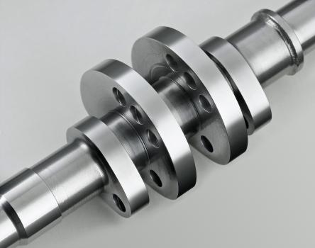 3) A camshaft after surface finishing in an Otec stream finishing machine