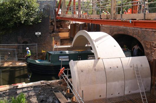 1) Disruption to traffic on the canal was minimal. Walls of the Matière bridge were craned into position with only limited need for over canal working