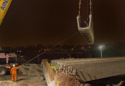 2) Lowering the massive bridge beams into position at the Raith Interchange