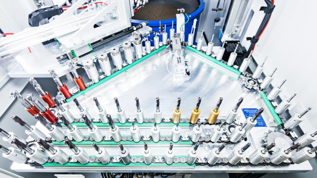 5) Otec SF1 stream finishing machine with chain feed for automatic loading and unloading for inline cutting tool production