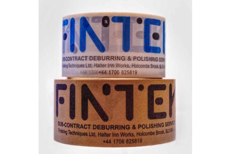 1) At Fintek paper tape (bottom) is replacing plastic tape (top) saving the equivalant of 9 miles in a single year