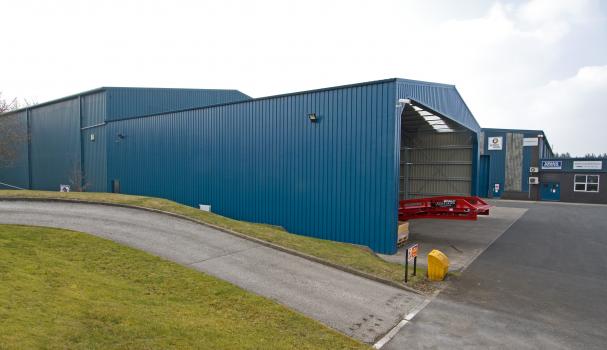 3) The light weight permanent steel extension is clad in ocean blue panels and matches the existing warehouse